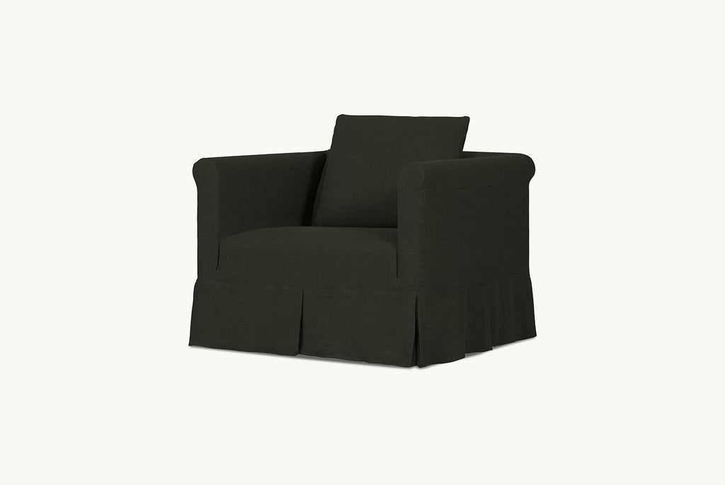 Dalia Chair Slipcover in New Leaf, a forest green linen-like recycled polyester.