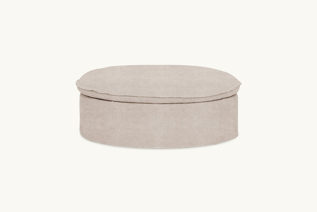Neva Round Storage Ottoman in Oat Flour, a medium taupe Light Weight Linen
