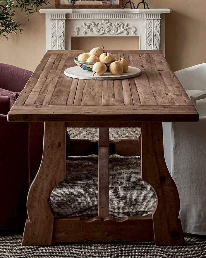 Leona Dining Table in Heritage Pine with a plate of pears placed on the tabletop
