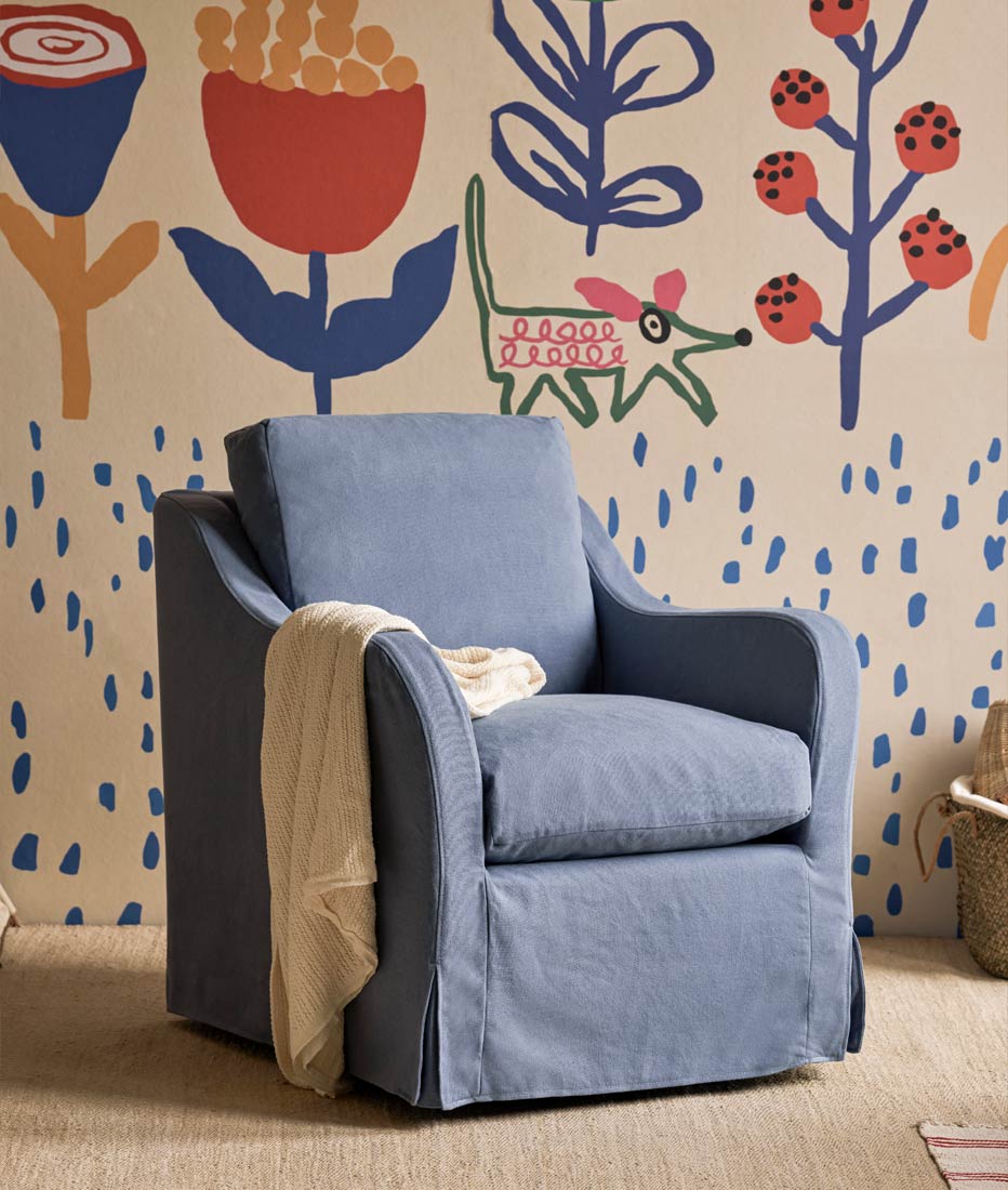 Esme Glider Chair in Thread Dyed Cotton Linen Garden Berry  placed in a children's playroom