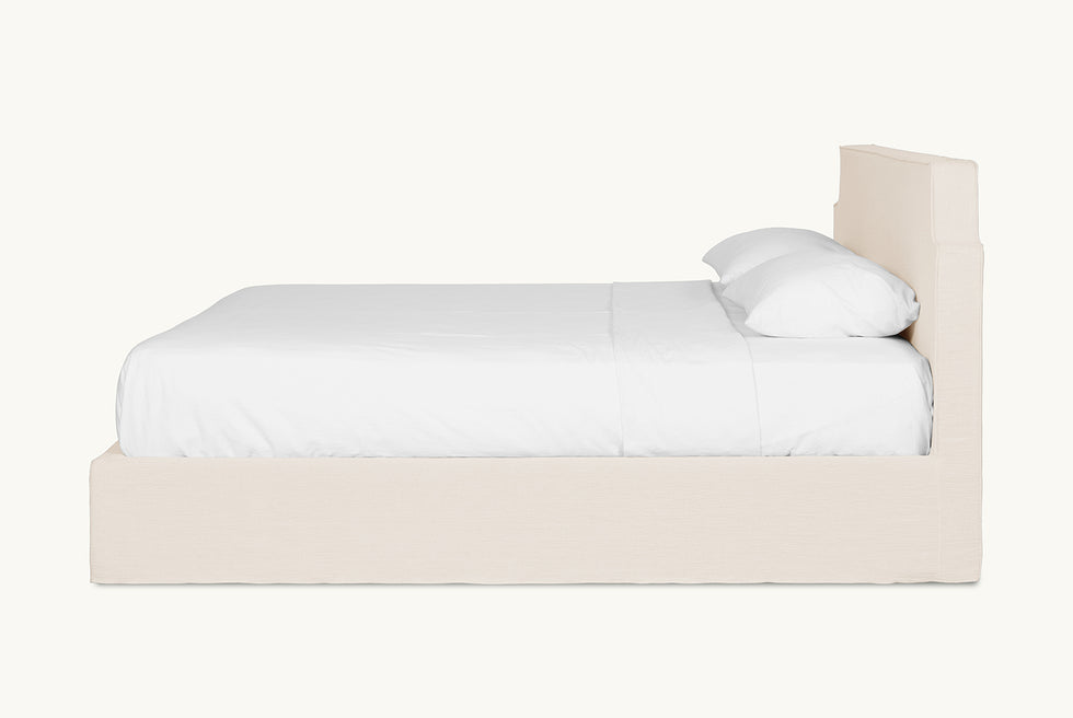 Side view of Amelia Bed in Corn Silk, a light beige Washed Cotton Linen
