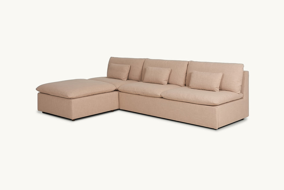 Angled view of Aria Sleeper Chaise Sectional in Golden Reed, a sandy brown Recycled Poly Linen