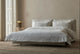 Slide #3 Aria Sleeper Sofa in Young Coconut, a powdery white Recycled Poly Linen, pulled out and made up with white bed linens