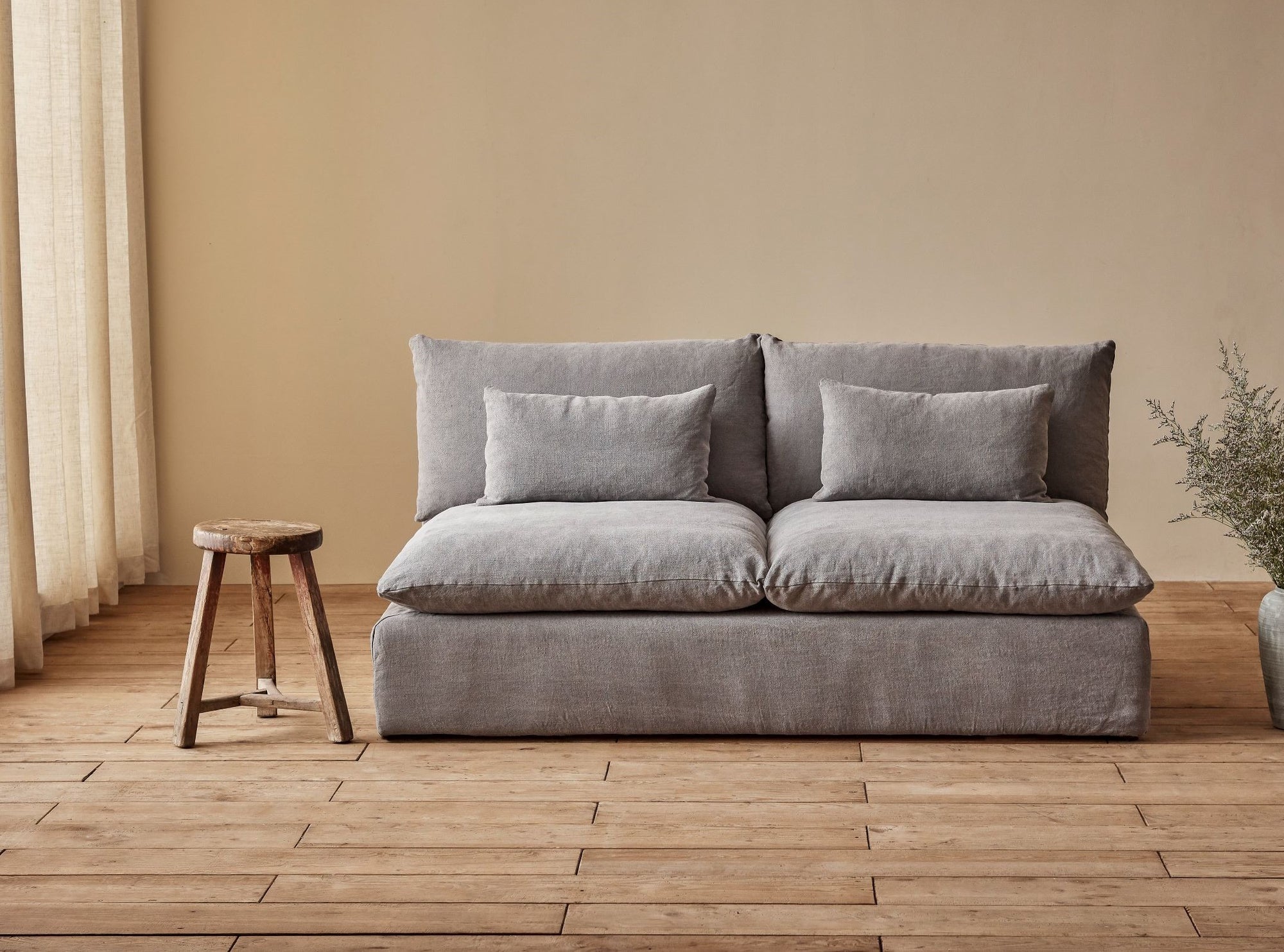 Aria 72" Sofa in Ink Cap, a medium cool grey Light Weight Linen placed in a room beside a stool