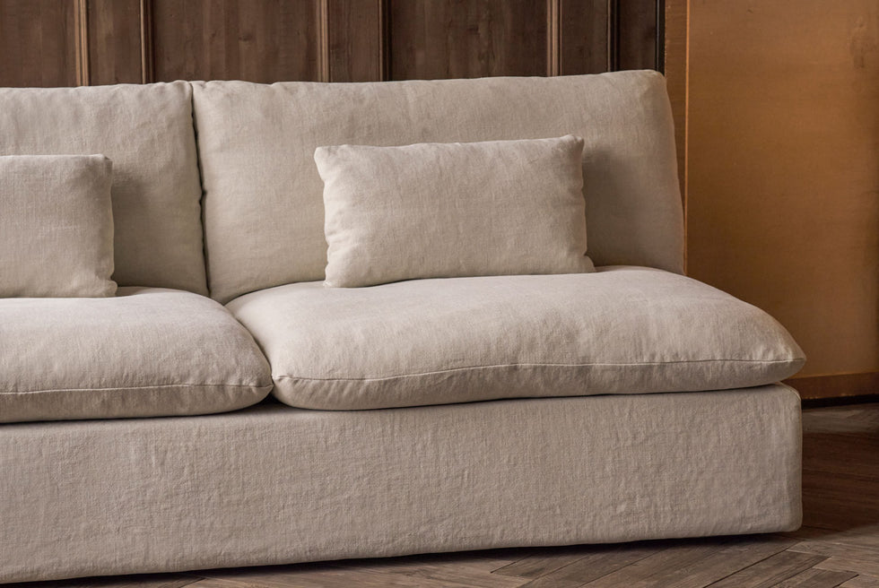 Angled close up view of the Aria 84" Sofa in Warm Oatmeal, a light warm beige Medium Weight Linen.