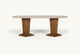 Slide #2 Front view of the Cordelia Dining Table in Turkish Galata Travertine in a warm beige with gold and pink undertones. Various veining, color variations, and pitting throughout. Legs made of 100% Reclaimed Chinese Pine