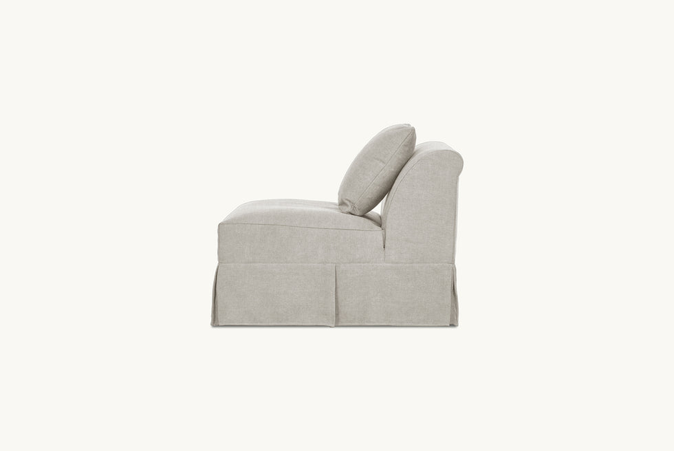 Side view of Dalia Armless Chair in Jasmine Rice, a light warm greige Medium Weight Linen