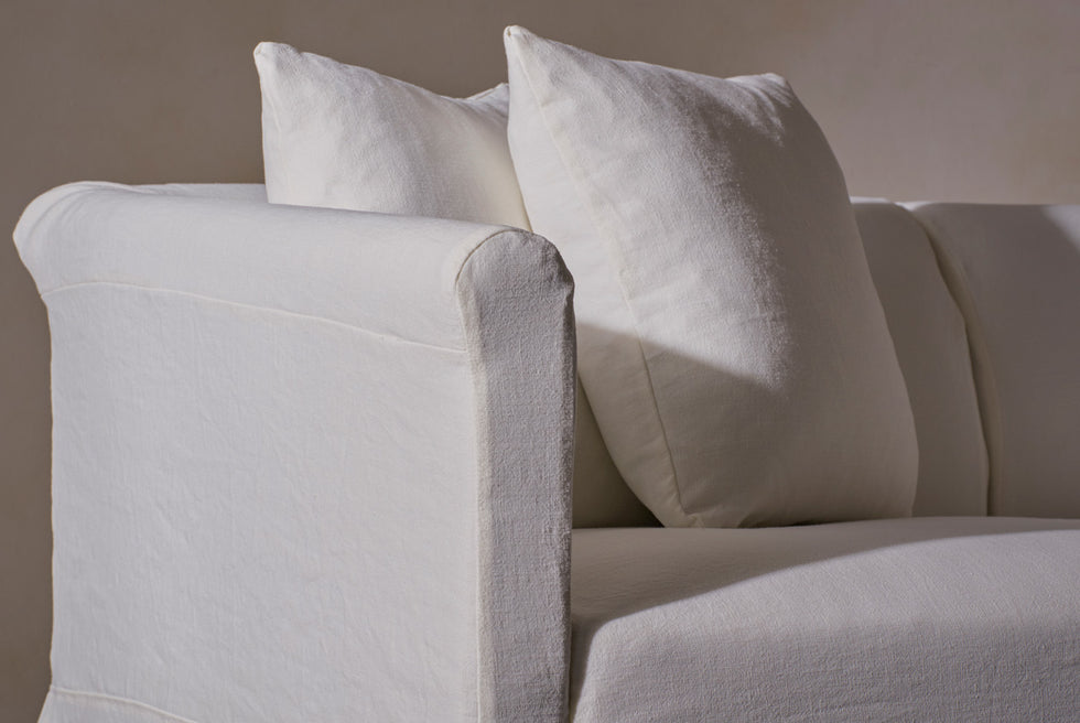 Close up of the Dalia Sectional in Water Lily, a white Light Weight Linen with warm undertones