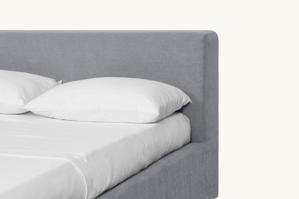 Closeup view of Devyn Queen Bed Headboard in Ink Cap, a medium cool grey Light Weight Linen