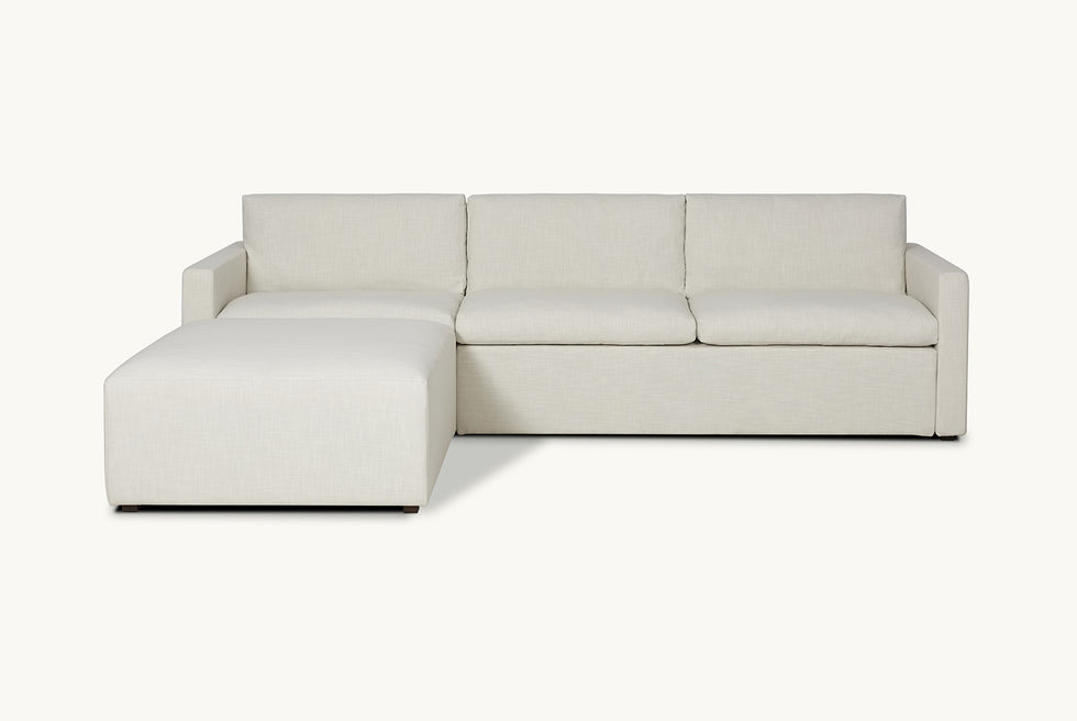 Front view of Devyn Sleeper Chaise Sectional in Young Coconut, a powdery white Recycled Poly Linen