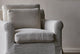 Slide #6 Close up of Elias Swivel Chair in Corn Silk, a light beige Washed Cotton Linen, in front of a greige wall 