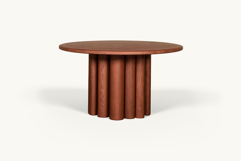 Front View of Enzo Round Dining Table in Spiced Oak, a smokey paprika-hued 100% American red oak