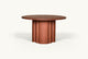 Slide #4 Side view of Enzo Round Dining Table in Spiced Oak, a smokey paprika-hued 100% American red oak