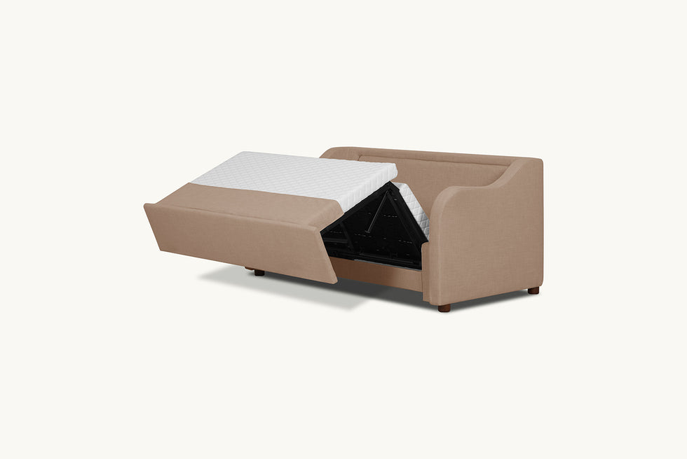 A view of the mattress and folding mechanism of the Esmé Full Sleeper Sofa in Golden Reed, a sandy brown Recycled Poly Linen 