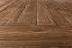Slide #7 Close up of Fasso Dining Tabletop in 100% Reclaimed Chinese Heritage Pine, a medium, bosc pear shade with earthy undertones