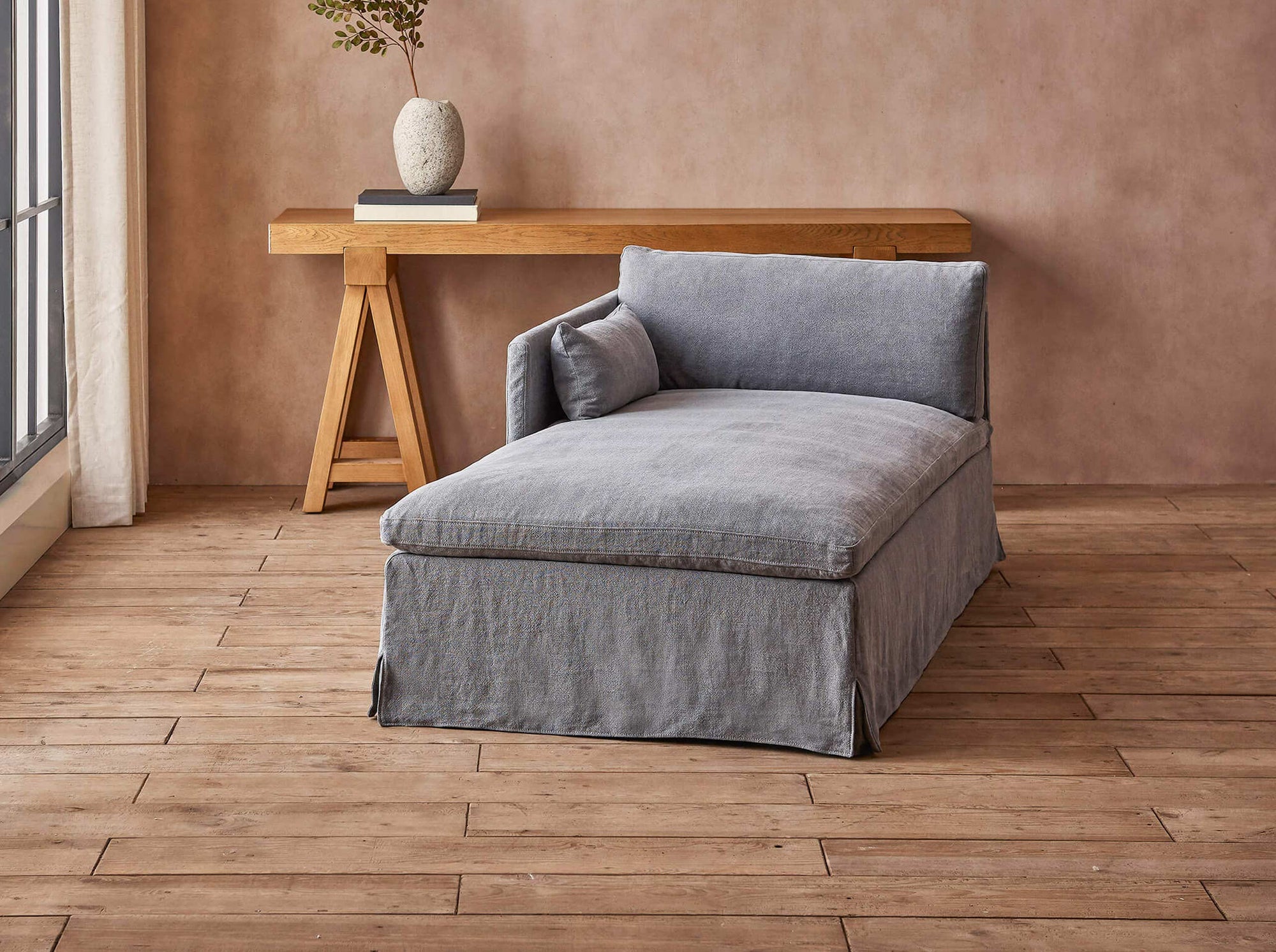 Gabriel Left Arm Facing Daybed in Ink Cap, a medium cool grey Light Weight Linen, placed in a room facing a sunlit window