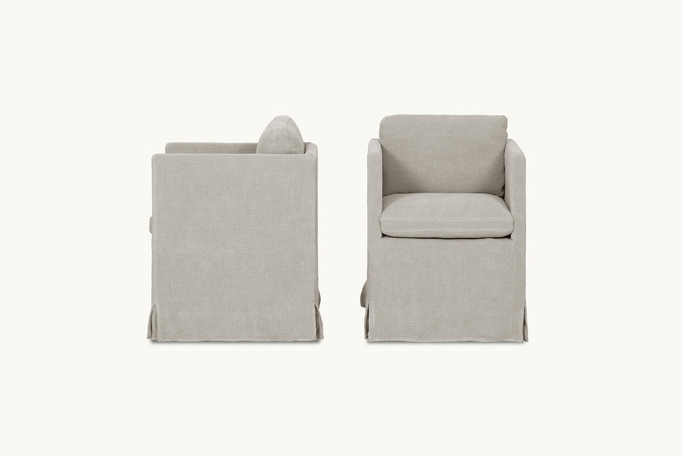 Front and side view of Gabriel Dining Chair in Jasmine Rice, a light warm greige Medium Weight Linen