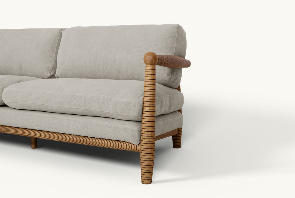 Detail view of Gio 84" Sofa frame in 100% American Heritage Ash, a medium, bosc pear shade with earthy undertones, and slipcover in Jasmine Rice, a light warm greige Medium Weight Linen