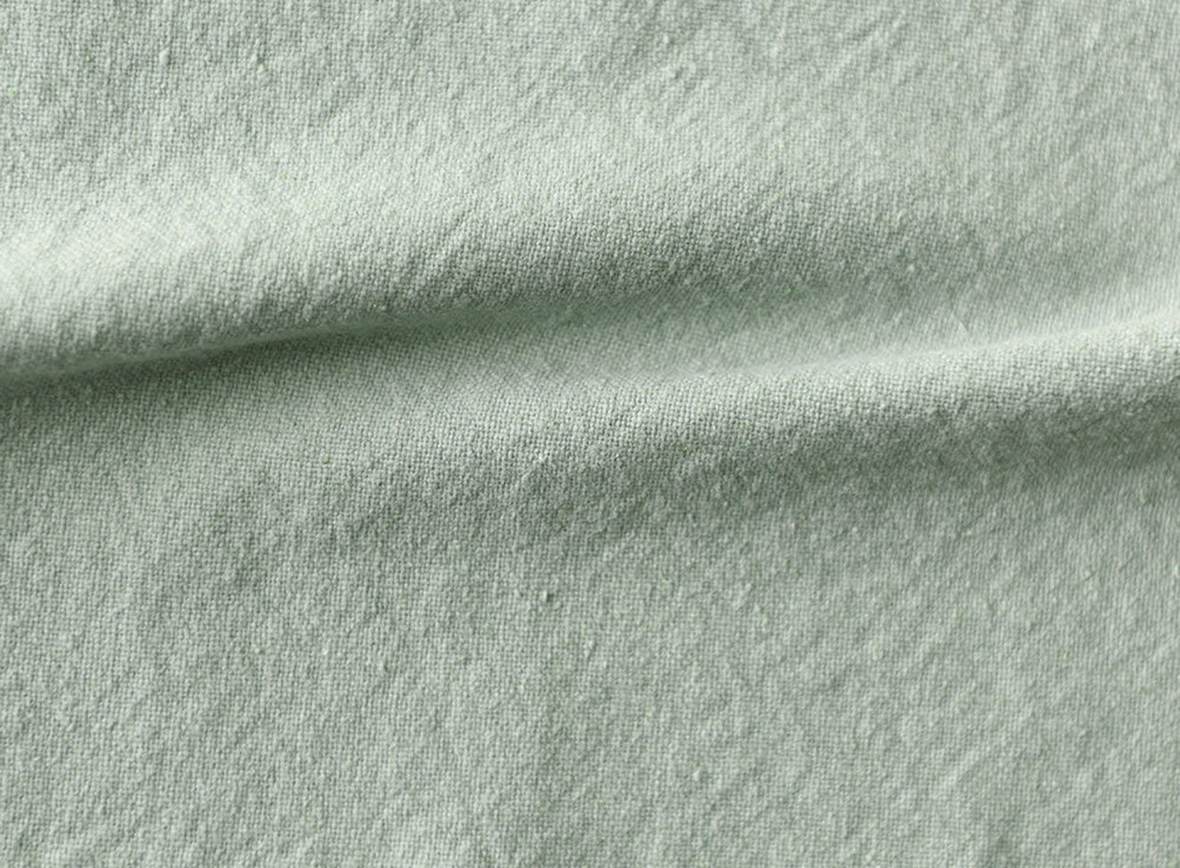 Swatch in Hello Aloe, a pale green Thread-Dyed Cotton Linen