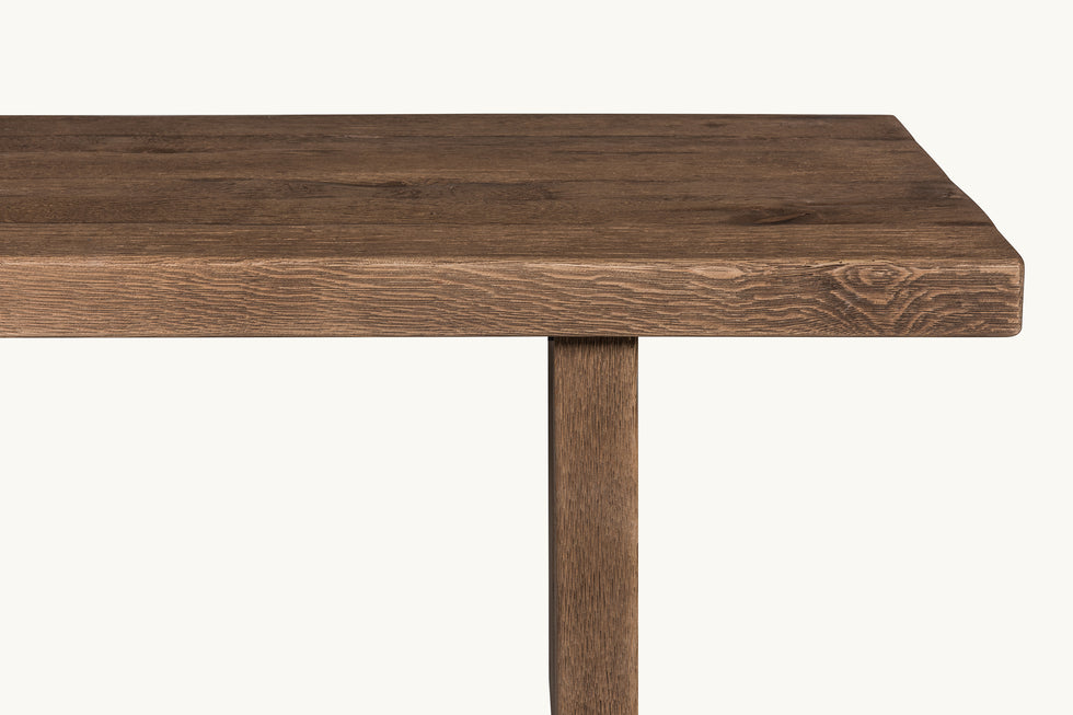 Close up of Kai Dining Bench in 100% Reclaimed Austrian Heritage Oak, a medium, bosc pear shade with earthy undertones