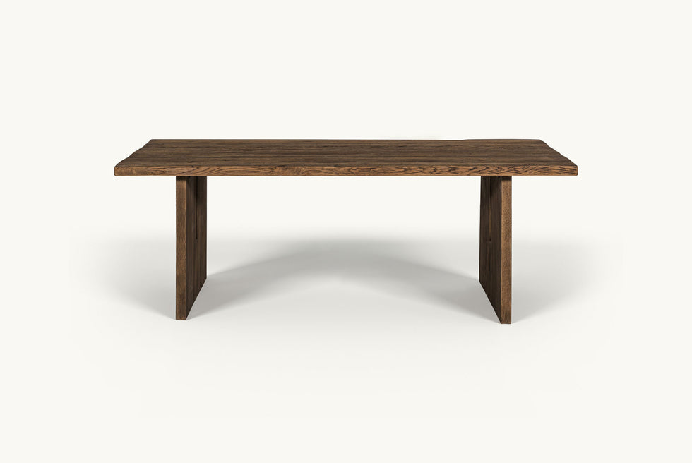 Front view of Kai Dining Table in 100% Reclaimed Austrian Heritage Oak, a medium, bosc pear shade with earthy undertones