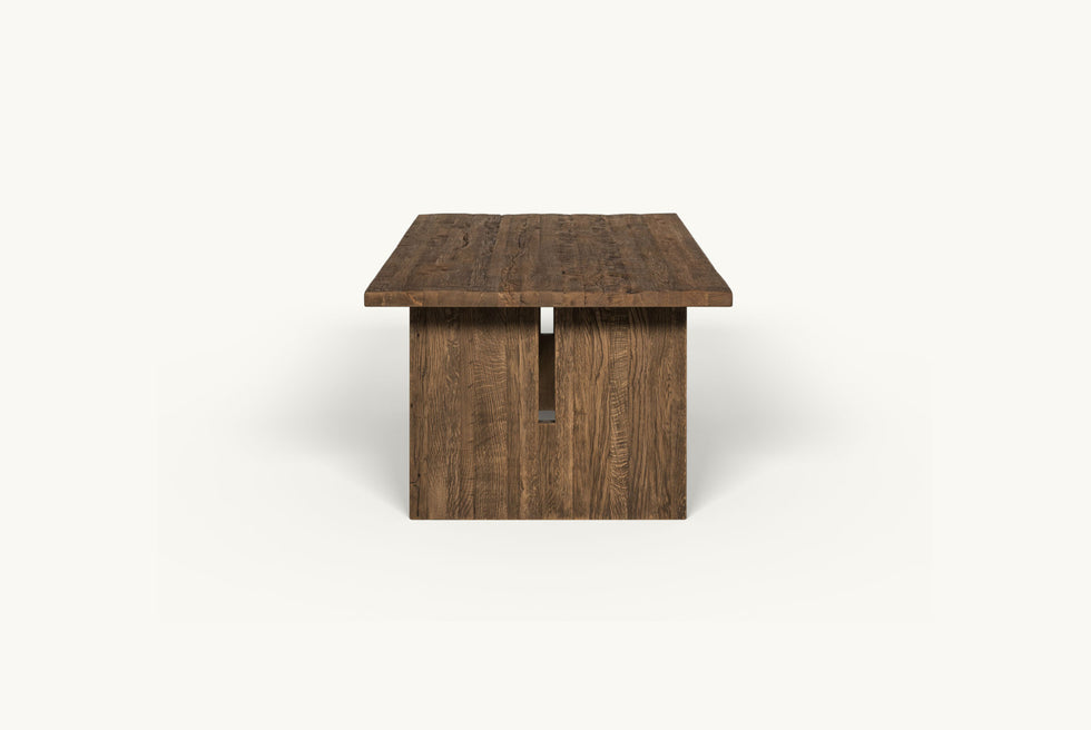 Side view of Kai Dining Table in 100% Reclaimed Austrian Heritage Oak, a medium, bosc pear shade with earthy undertones