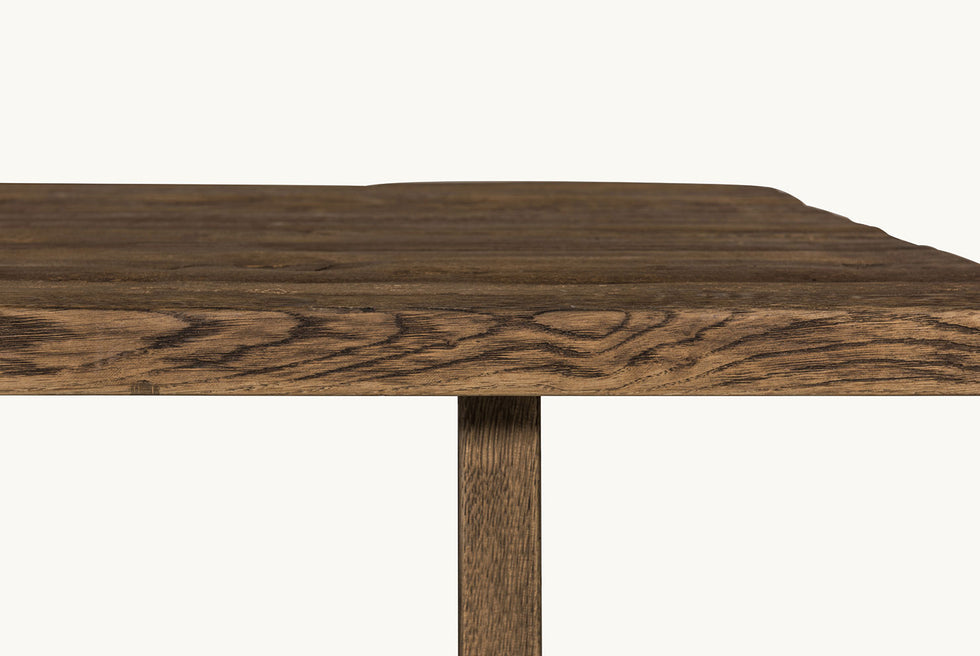 Close up tabletop view of Kai Dining Table in 100% Reclaimed Austrian Heritage Oak, a medium, bosc pear shade with earthy undertones