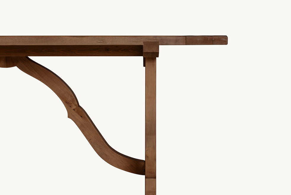 Close up view of Leona Dining Table in 100% Reclaimed Chinese Heritage Pine, a medium, bosc pear shade with earthy undertones