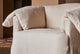 Slide #6 Close up of Loula Swivel Chair in Corn Silk Washed Cotton Linen, placed in a warmly lit room