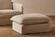 Slide #4 Close up of Neva Chair Ottoman in Corn Silk, a light beige Washed Cotton Linen, placed in front of a Neva Chair