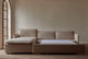 Slide #3 Neva Sleeper Chaise Sectional in Golden Reed, a sandy brown Recycled Poly Linen, open with no bed linens agaisnt a beige wall