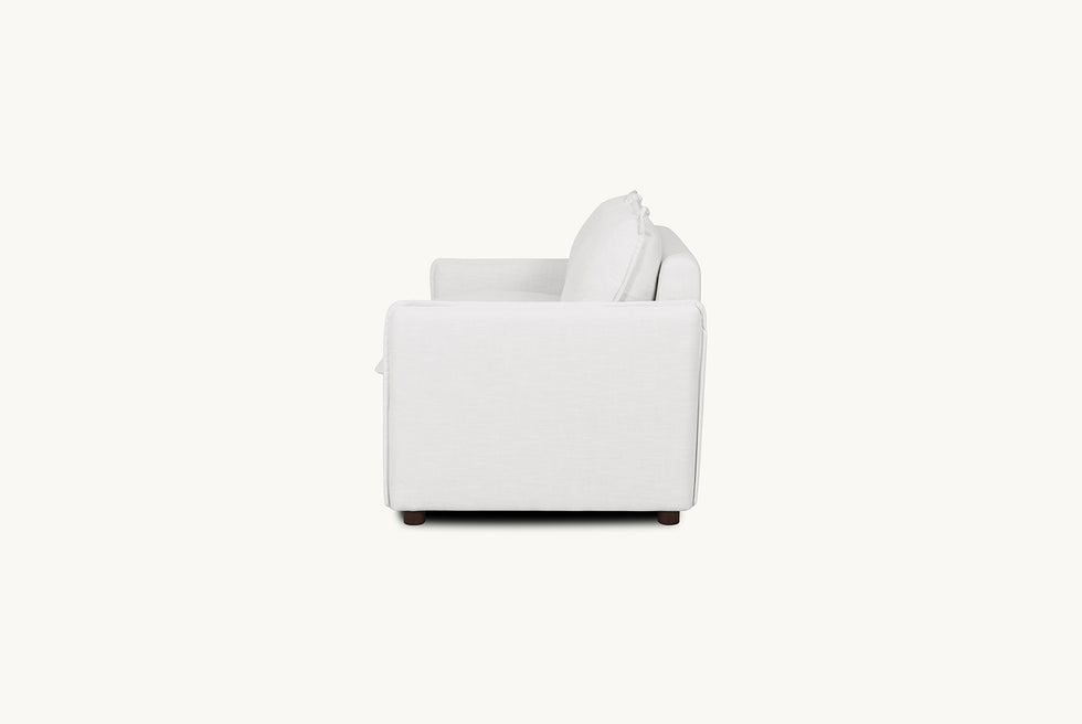 Side view of Neva Full Sleeper Sofa in Young Coconut, a powdery white Recycled Poly Linen