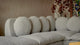 Slide #6 Close up of Olea L-Shape Sectional Sofa in Jasmine Rice, a light warm greige Medium Weight Linen, placed in a room decorated with art and a plant