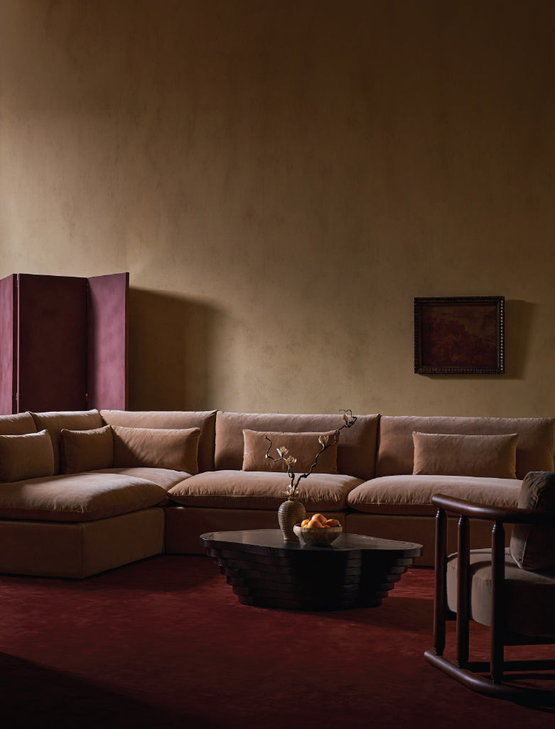  living room with sixpenny sectional sofa, tera coffee table, and decorative elements.