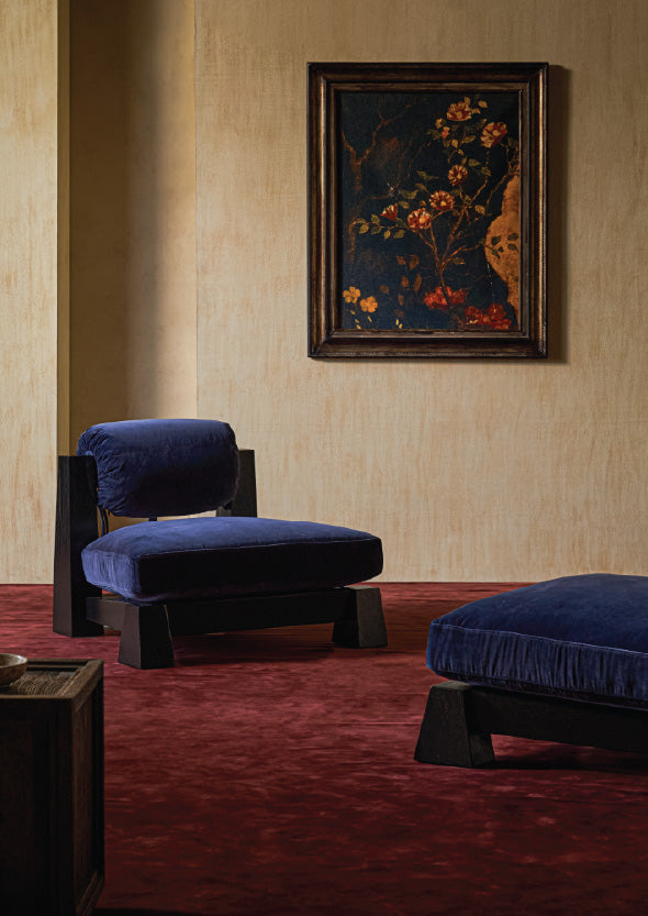 sixpenny two tango chairs in a room with a framed painting on the wall