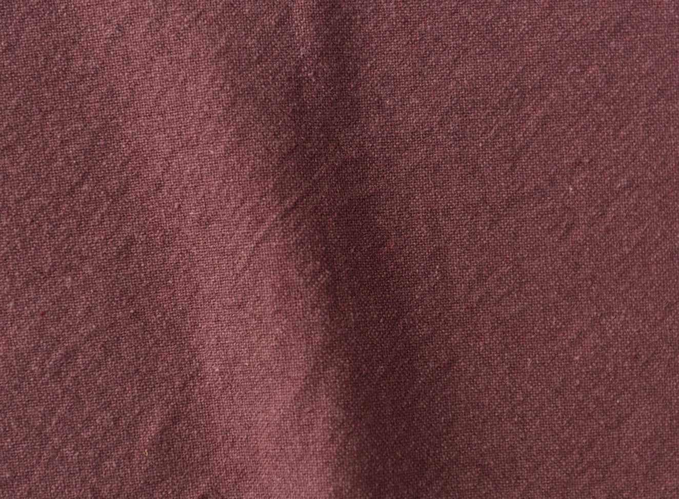 Swatch in Summer Plum, a soft maroon Thread-Dyed Cotton Linen