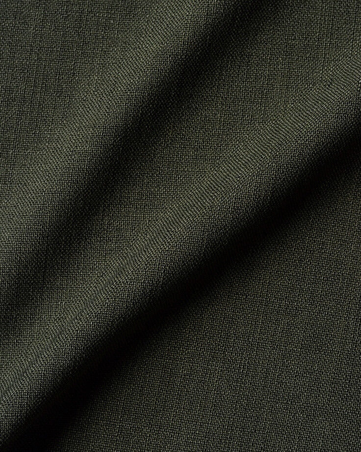 Swatch of New Leaf, a forest green linen-like recycled polyester.