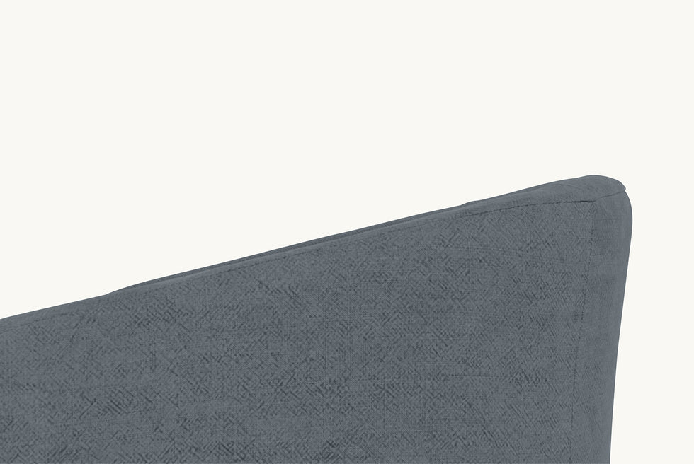 Detailed shot of a Ziki Dining Chair in Ink Cap, a medium cool grey Light Weight Linen