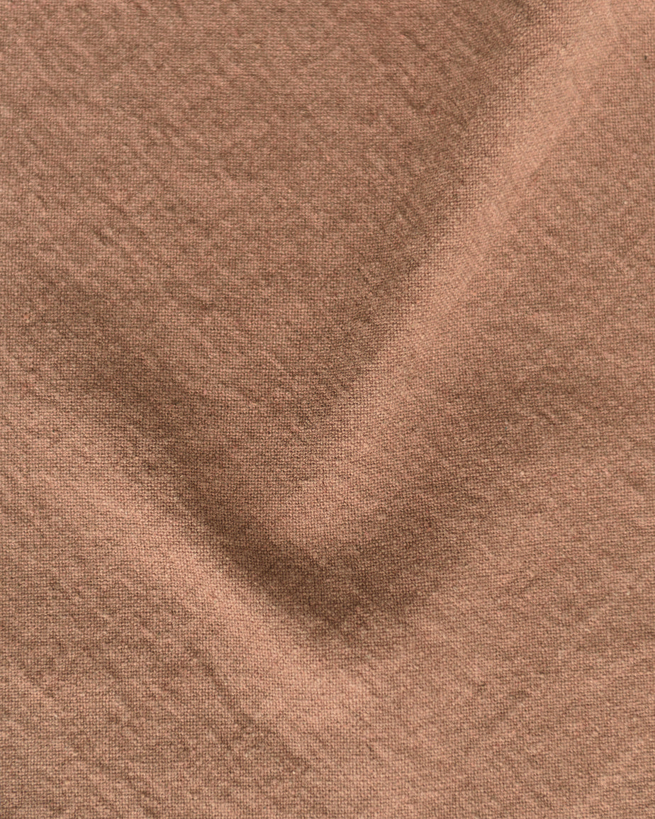 Swatch of Nectarine Dream, a muted terracotta Thread-Dyed Cotton Linen