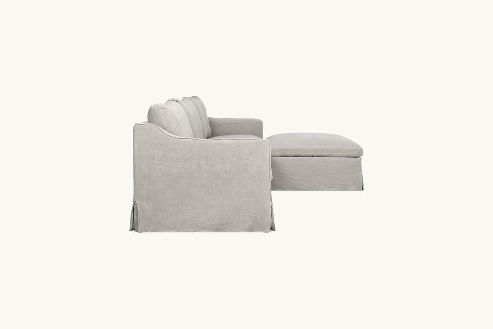 Side view of Amelia 4-piece Chaise Sectional Sofa in Jasmine Rice, a light warm greige Medium Weight Linen