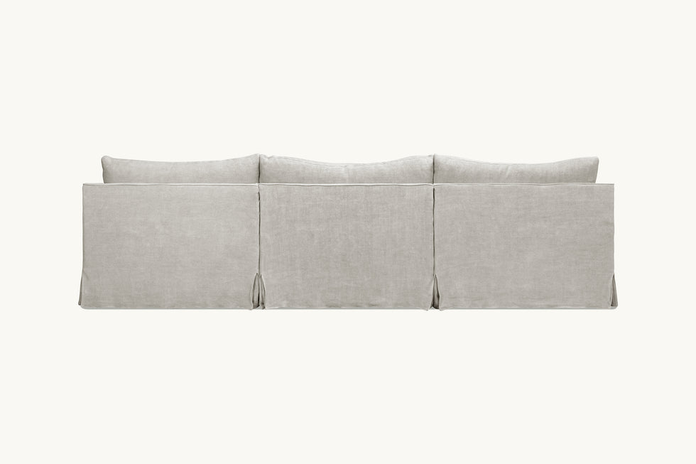 Back view of Amelia 4-piece Chaise Sectional Sofa in Jasmine Rice, a light warm greige Medium Weight Linen
