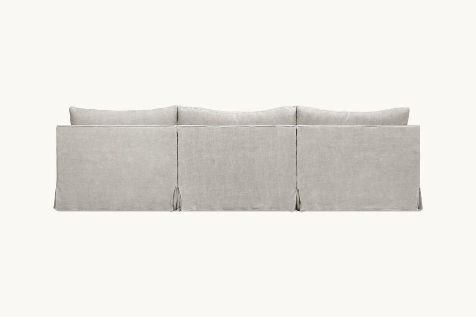 Back view of Amelia 4-piece Chaise Sectional Sofa in Jasmine Rice, a light warm greige Medium Weight Linen