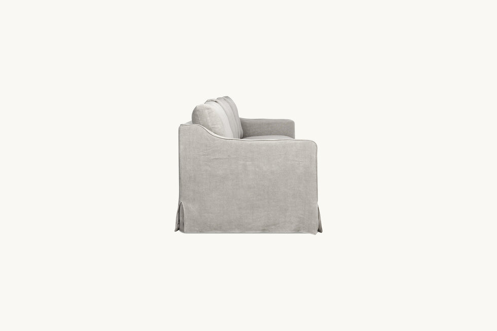 Side view of Amelia Sectional Sofa in Jasmine Rice, a light warm greige Medium Weight Linen