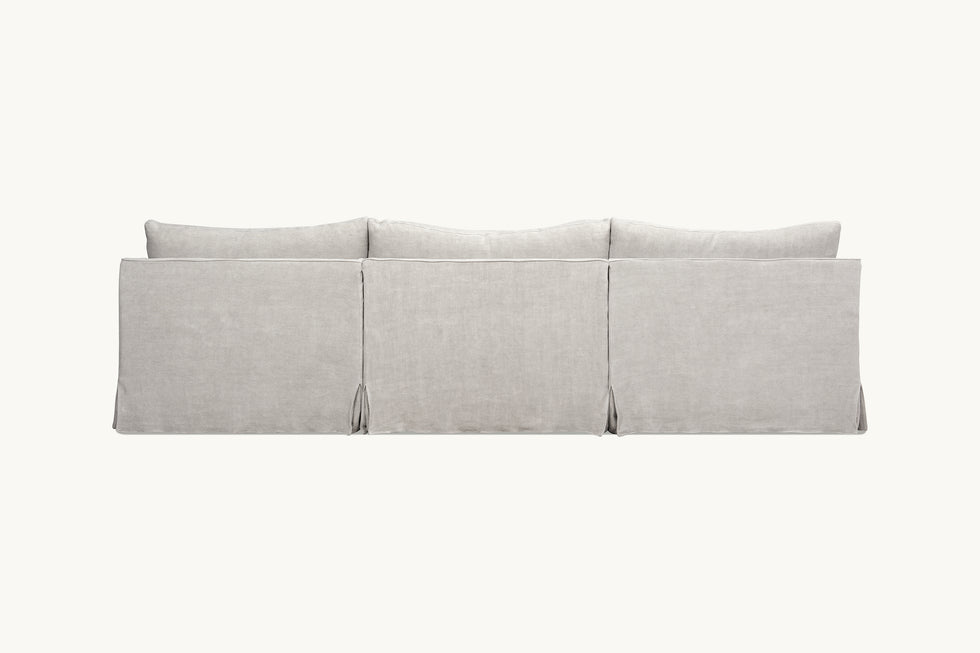 Back view of Amelia Sectional Sofa in Jasmine Rice, a light warm greige Medium Weight Linen
