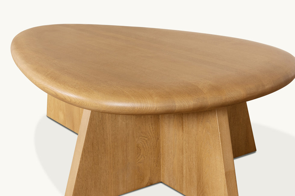 Close up, top view of Amina Coffee Table in Tinted Oak, a golden, wheat-colored 100% American red oak