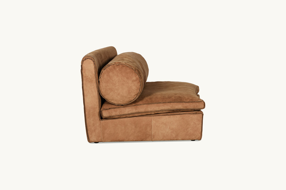 Side view of Camino Leather Chair in Sunset Canyon, a cognac brown Meridian Leather