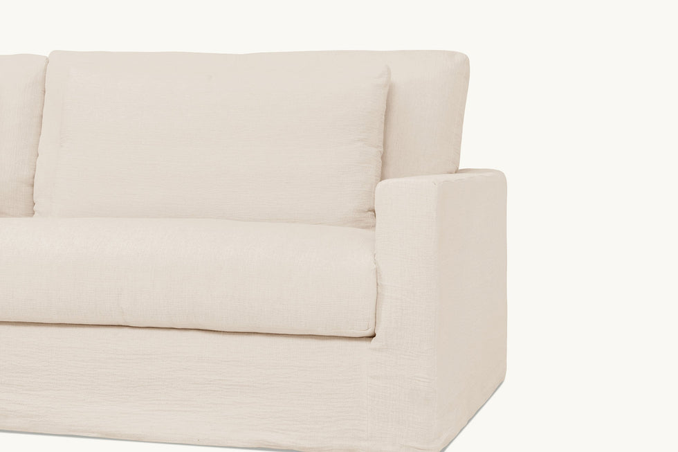 Close up view of Devyn L-Shape Sectional Sofa in Corn Silk, a light beige Washed Cotton Linen