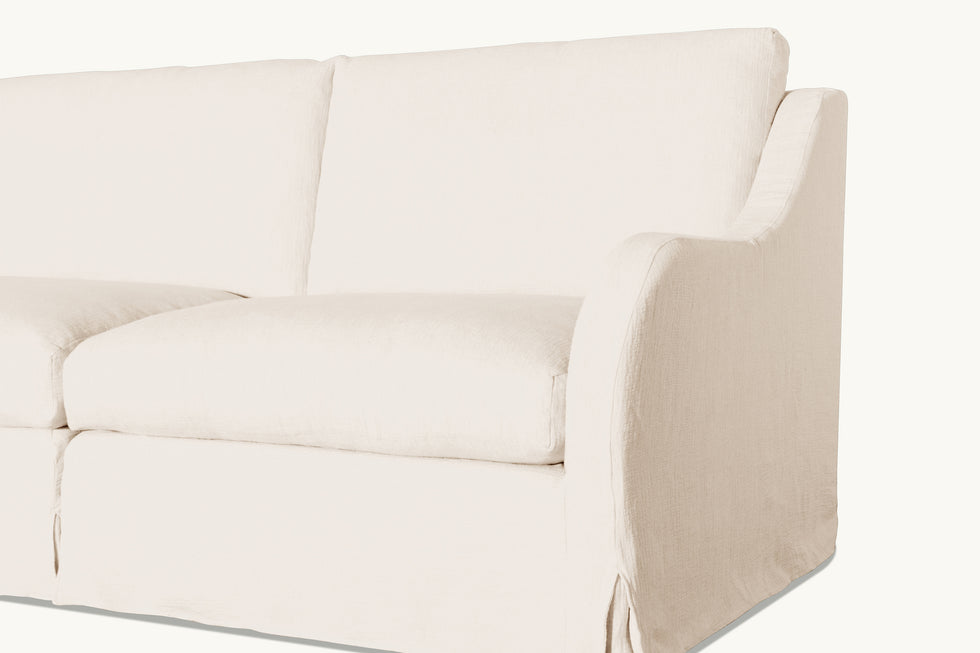 Close up view of Esmé Corner Sectional Sofa in Corn Silk, a light beige Washed Cotton Linen