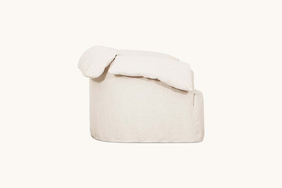 Side view of Loula Swivel Chair in Corn Silk, a light beige Washed Cotton Linen