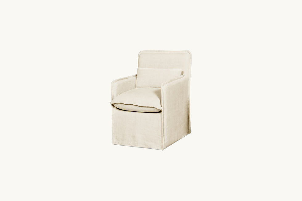 Front angled view of a Melo Dining Chair in Warm Oatmeal, a light warm beige Medium Weight Linen